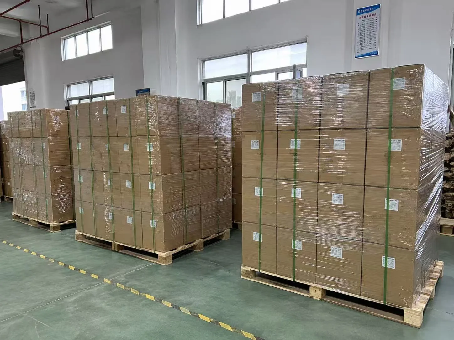 Finished flexible packaging cartons on pallets for shipment